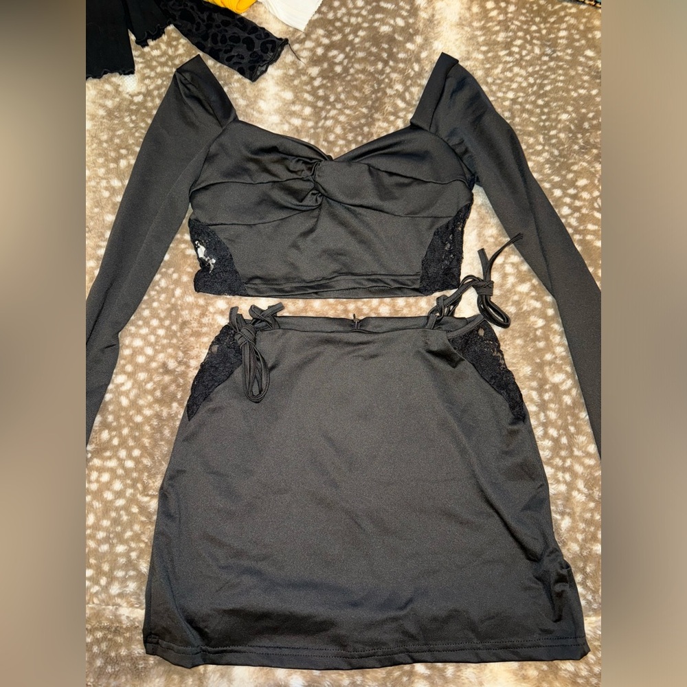 Black two piece set. Skirt and cropped long sleeve. Size small